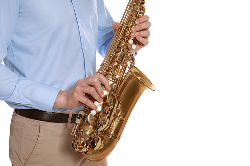 Man with saxophone on white background, closeup