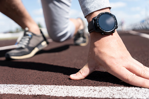 man smartwatch on wrist. Checking training info after workout. Monitoring of daily health. Closeup. Place for text on empty black screen. copy space,