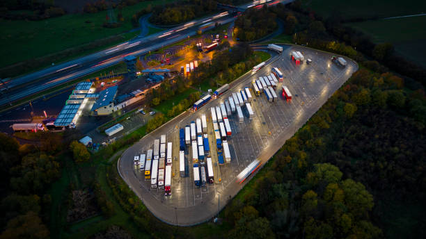 istock Highway and rest area at dusk - aerial view 1450328682
