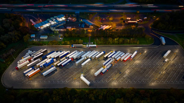 istock Highway and rest area at dusk - aerial view 1450328723
