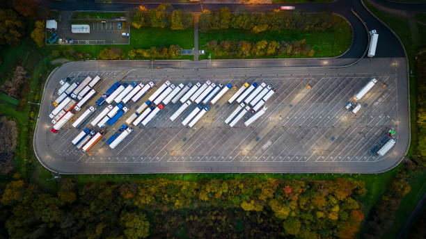 istock Trucks on parking lot - aerial view 1450328746