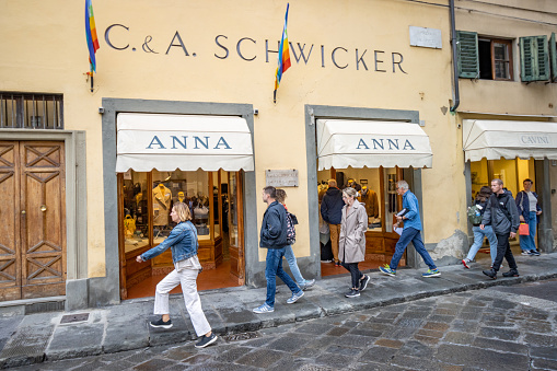 Customers outside C&A Schwicker Antique Oil Paintings at Piazza de Pitti in Florence in Tuscany, Italy