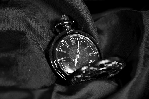 Photograph of a pocket watch in black and white