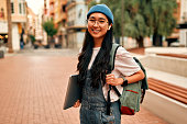 Asian female tourist student on city streets