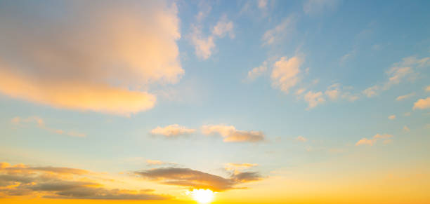 istock clouds and orange sky,Real amazing panoramic sunrise or sunset sky with gentle colorful clouds. Long panorama, crop it 1450332123