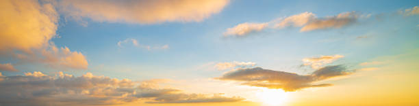 istock clouds and orange sky,Real amazing panoramic sunrise or sunset sky with gentle colorful clouds. Long panorama, crop it 1450332156
