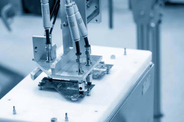 istock The high technology electronic industrial  by robotic arm with mother board. 1450332207