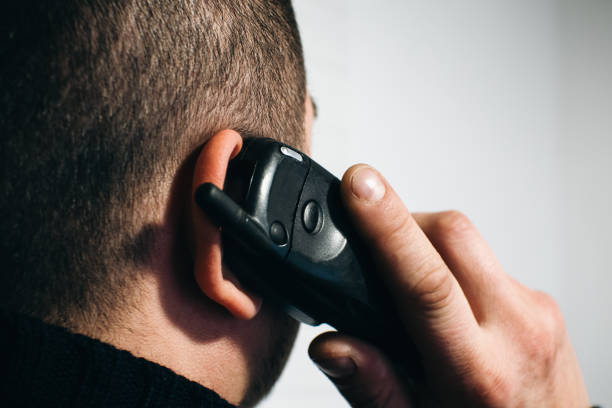 MAn is calling with Old mobile phone slider. Pastime, Retro technology.