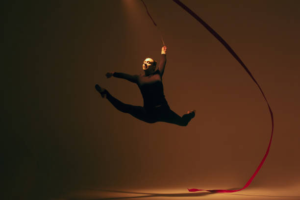 istock Beautiful woman rhythmic gymnast 1450333643