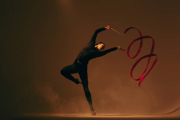 A female competitor in a Rhythmic Gymnastics event