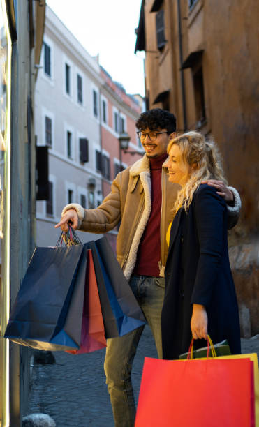 istock Young multi-ethnic couple doing Christmas shopping 1450333854