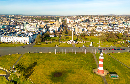 Plymouth, UK. 16 December 2022. Cars parked on Plymouth Hoe with Smeaton's Tower