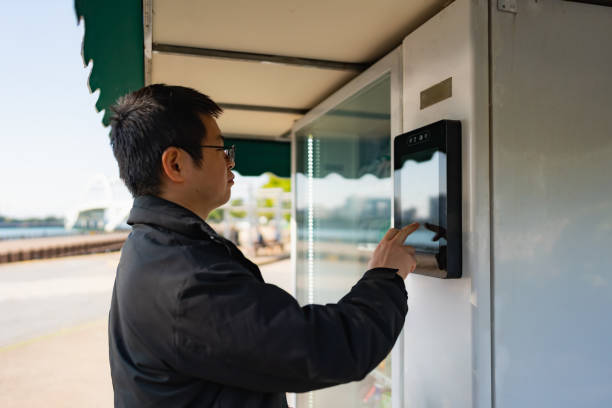 istock Man buying something from a vending machine outdoors 1450334411