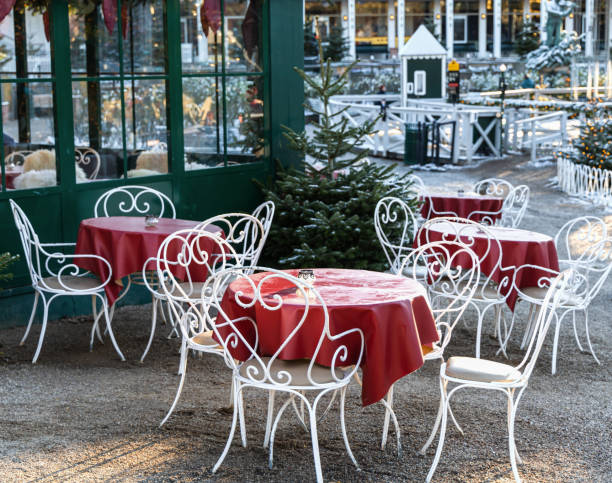 Cozy street cafe with empty tables on a winter day in Tivoli, Copenhagen.