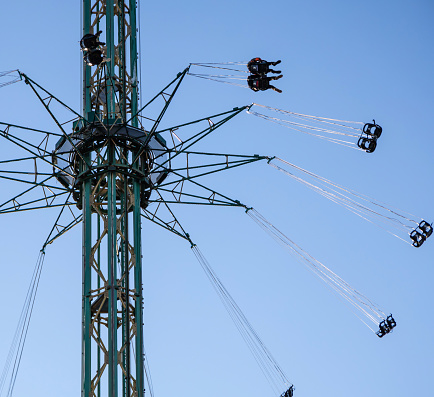 Amusement park. Spinning carousel at Tivoli Gardens. Copenhagen, Denmark.