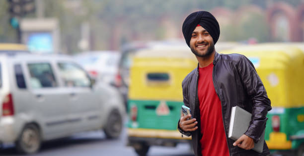boy going college Studying with Using A Textbook stock photo Sikhism Student