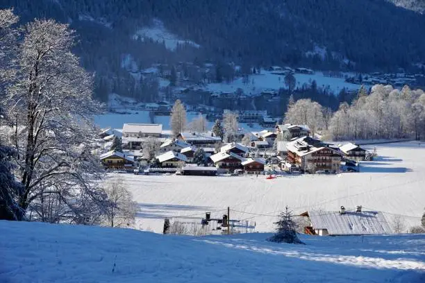 The village of Königssee in winter. A Bavarian village under the snow. A snow-covered German village. A village in Berchtesgaden in winter under the snow.