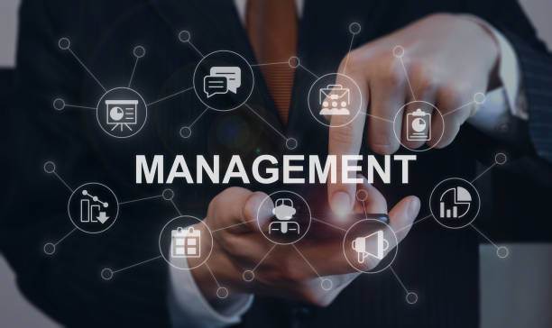 istock Management closeup concept image with white glyph icons 1450344634