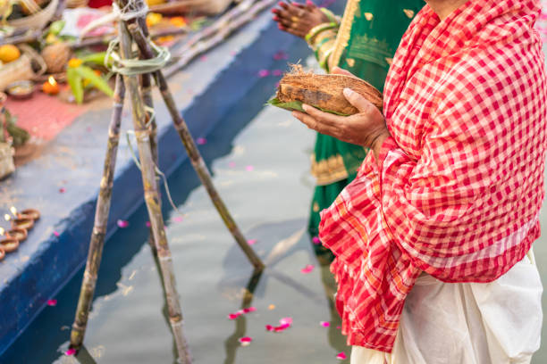 istock man devotee with religious offerings for sun god during Chhath festival from flat angle 1450345473