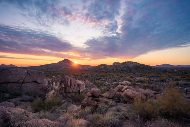 istock Interesting boulder-filled landscape with majestic sunset over Brown's Mountains in The McDowell Sonoran Preserve 1450347375