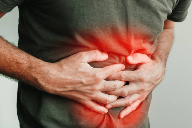 Gastritis, painful stomach inflammation process Gastritis, painful stomach inflammation process, adult male in pain stomach cancer stock pictures, royalty-free photos & images