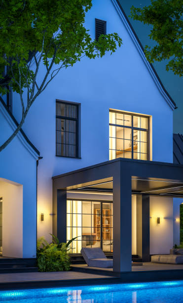 istock 3d rendering of white and black modern Tudor house in night 1450349717