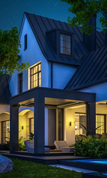 istock 3d rendering of white and black modern Tudor house in night 1450349722