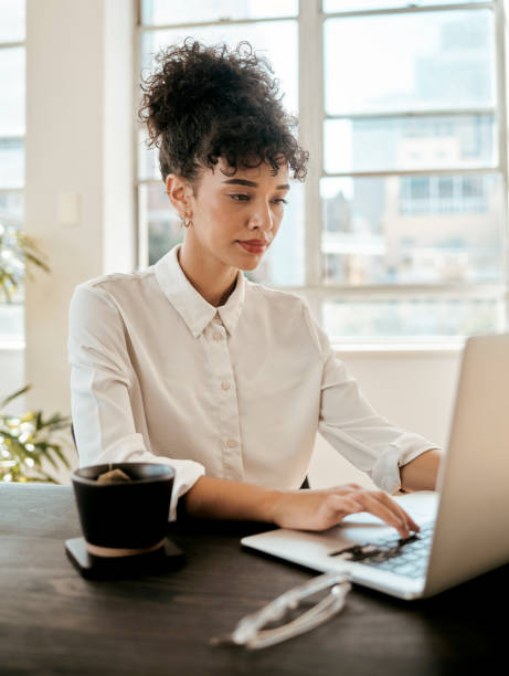 istock Business woman, computer working and typing with morning tea planning a web design. Software programming and website designer online doing digital coding research for company ux and seo data project 1450349916