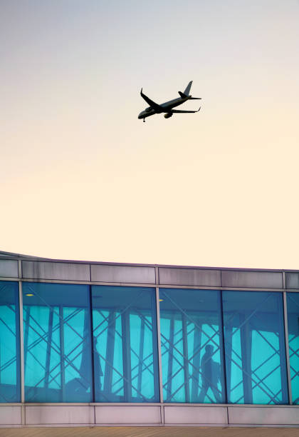 istock Close up airport arrival and departure gate with passengers 1450354786