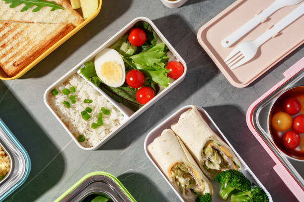 istock Containers with healthy food on gray background top view. 1450354829