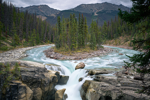 A picture from Sunwapta Falls in the morning. Sunwapta Falls is a waterfall at Sunwapta River in Jasper National Park.