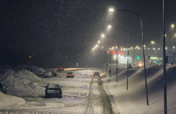 istock Falling snow in city. Winter weather. 1450355299