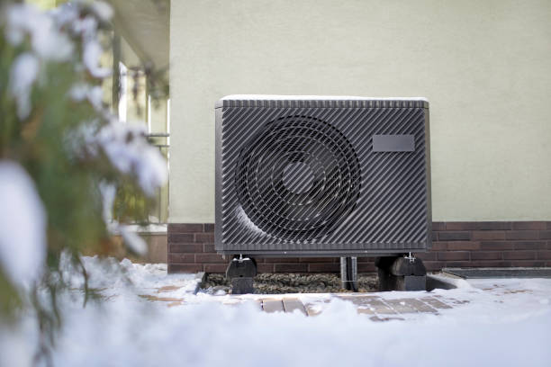 luftwärmepumpe unter winterlichen bedingungen - wärmepumpe stock-fotos und bilder