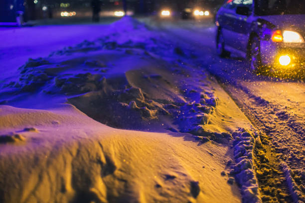 istock Falling snow in city. Winter weather. 1450357186