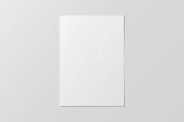 istock Blank sheet of paper mock up on the white table. 1450357244