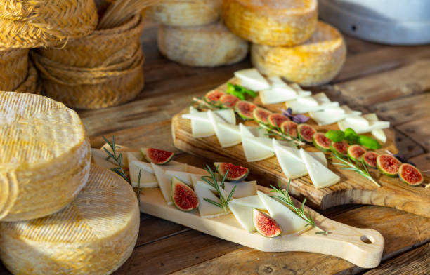istock Sliced goat cheese with rosemary, basil and figs for tasting 1450360563
