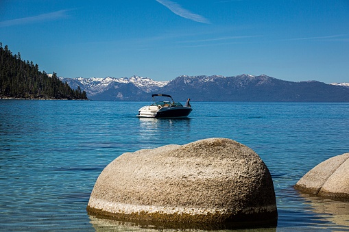 The smooth rounded rocks and crystal clear waters of Lake Tahoe makes it one of the top travel destinations in California.