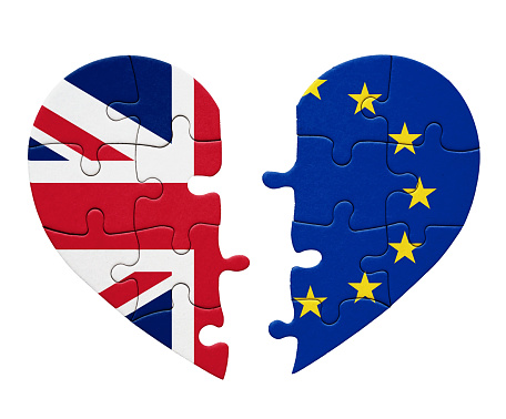 Representing either Brexi or a new rapprochement, the flags of the UK and the EU on two separated halves of a heart-shaped jigsaw puzzle.