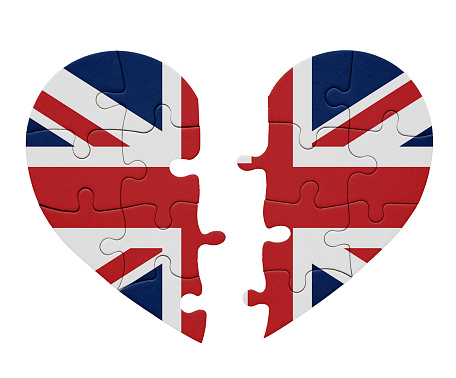 Representing either division or impending unity, the flag of the UK, the Union Jack, on two separated halves of a heart-shaped jigsaw puzzle.