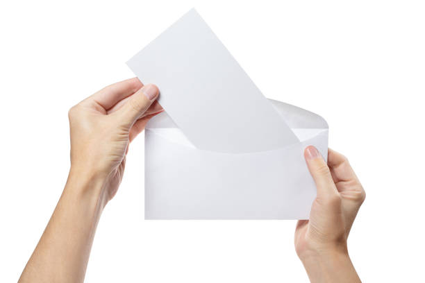 istock Hands taking blank paper out of white envelope on white 1450364077