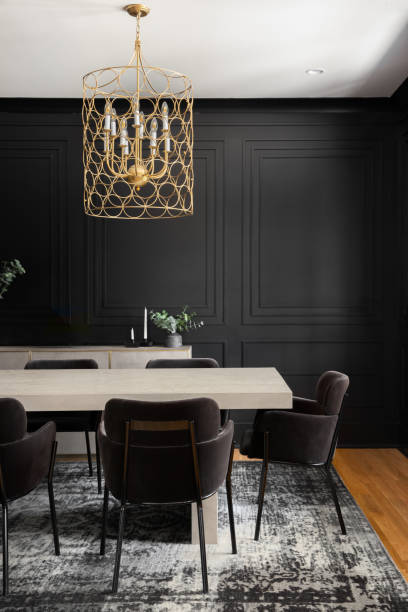 istock A black dining room with gold lights. 1450364150