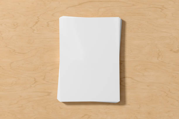 istock Stack of paper mockup on the wooden table. 1450365475