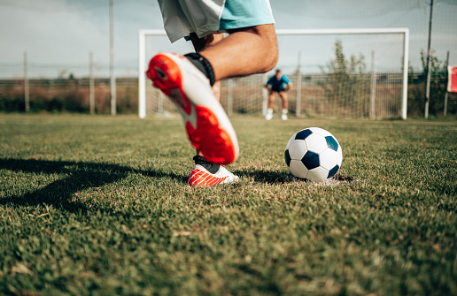 Football player, winner team and people winning in competition, game or sports goals, success and cheers. Yes, wow and excited group of young men with achievement and soccer celebration on blue sky