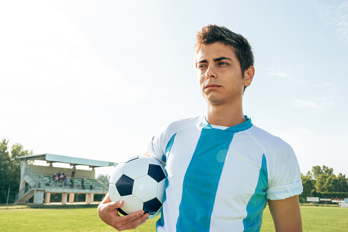 serious argentinian soccer player portrait