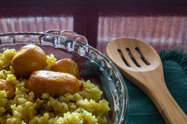 istock Brown rice with pequi. (Caryocar Brasiliense) 1450366472