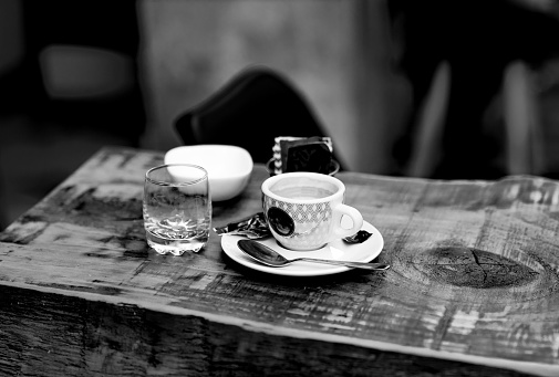 Espresso cup on table in black and white
