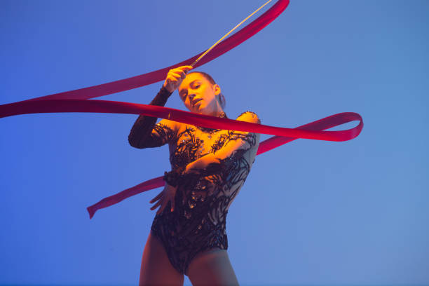 istock Beautiful woman rhythmic gymnast 1450370541