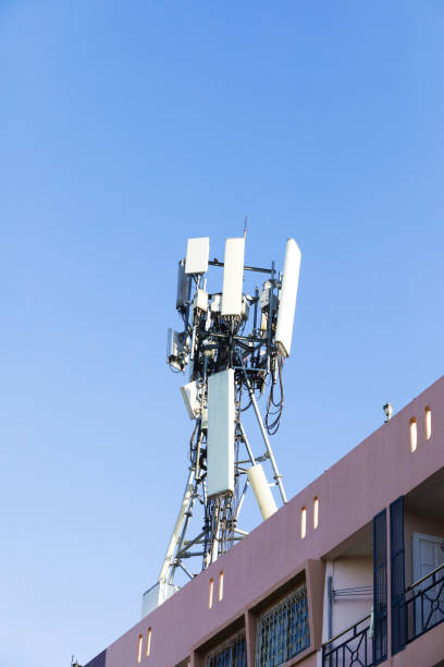 istock Mast with 4g and 5g repeaters on condominium 1450370608