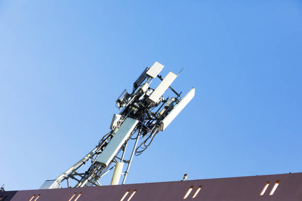 istock Mast with 4g and 5g repeaters on rooftop 1450370647