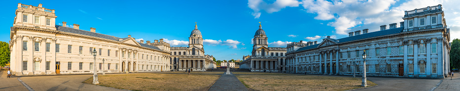 Panoramic view across the parade ground of the Old Royal Naval College to Greenwich Hospital in Maritime Greenwich, London, UK.